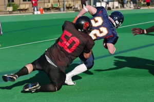 Linebacker David Quigley wraps up the Outlaws Running Back.